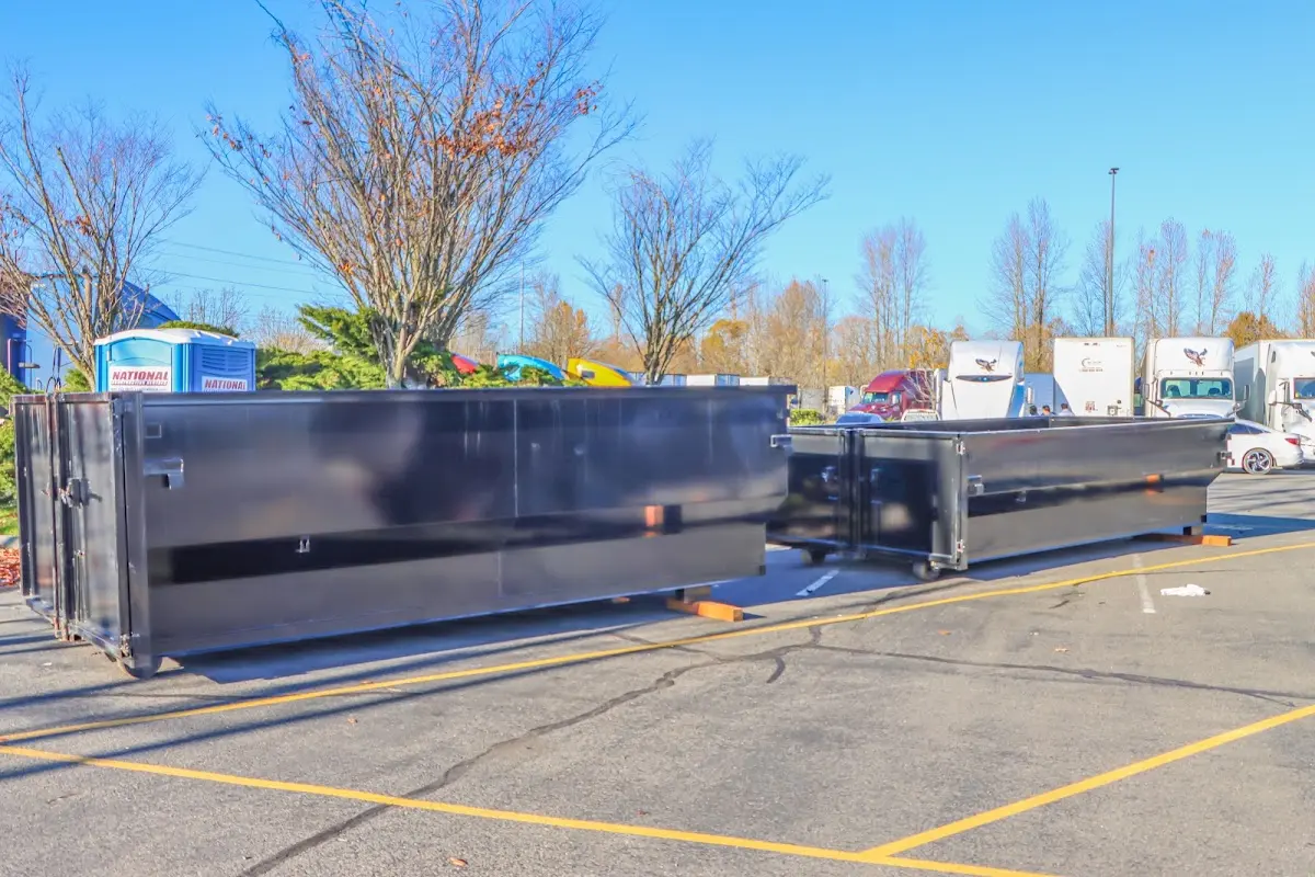 Professional dumpster rental service with roll-off container on residential driveway in Willow Oak